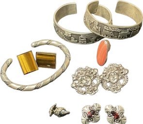 Cuff Bracelets, Ring And Earrings With Gemstone, Pierced Earrings.