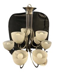 9 Light Chandelier, Silver Colored With Frosted Glass. Includes Ceiling Mount. 28x28x26