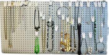 Assortment Of Necklaces And Belt On Peg Board