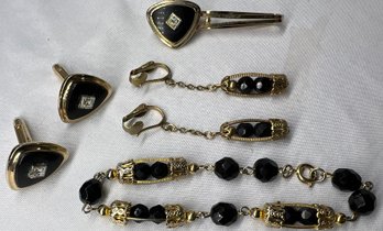 Pair Of Black And Gold Toned Cuff Links And Tie Clip And Black And Gold Toned Bracelet With Matching Clip Ons