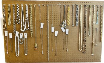 Avon, Revlon And Other Necklaces On Peg Board