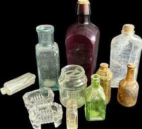 Antique Bottles Of Colored And Clear Glass