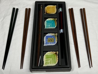 Collection Of Chopsticks And Ceramic Leaf Chopstick Rest