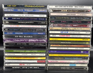 Assortment Of Classic CDs Including The Beatles, Barry White, Jesse Cook And Etc. (total Of 36)
