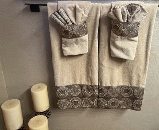 Decorative Towel Set, Three Candles On Metal Stands & Brown Tone Shower Curtain With Leaf Shaped Hooks.