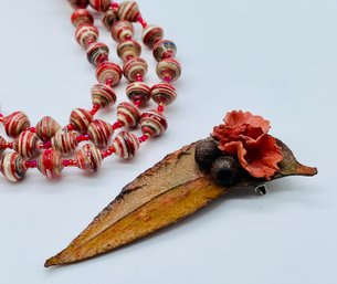 Beaded Necklace, Brown And Red Tones. 18 Inches. Leather Leaf Shape Pin.