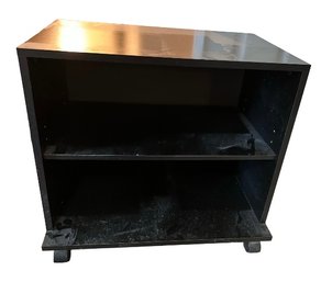 A Movable Black Particle Board Storage Cabinet With Wheels - 23.5x17x20.5