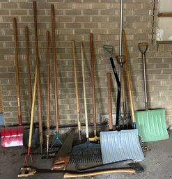 A Collection Of Maintenance Tools: Shovels Rakes, Saws  & Other Yard Tools