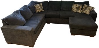 Charcoal Sectional With Attached Ottoman: 116x89x64'