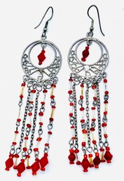 Pierced Silvertone Dangling Earrings With Red Gemstones