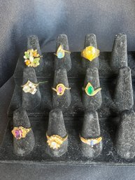 9 Gold Toned Rings With Gems
