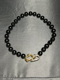 17 Inch Necklace With 28 Black Onyx Beads & Sterling Silver And 18K Yellow Gold Double Heart Motif Clasp