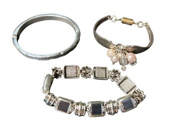 Trio Of Silver Colored Bracelets With Magnetic Clasps