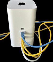 Apple AirPort Extreme Apple (2 Of 2) Yellow Blue And White Cords