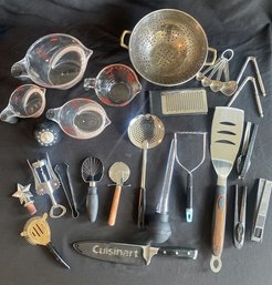 A Variety Of Kitchen Utensils And Measuring Devices.