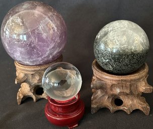 3 Glass Balls On Wood Stands