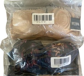 2 New In Packaging Victorias Secret Victoria Sport Bras Size 38 C.  1 Camel And 1 Black Multi Color Design.