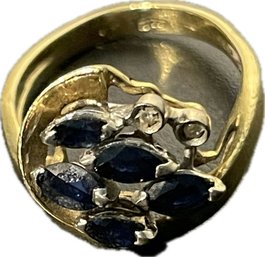 Ring With Midnight Blue Gemstones. Marking Says 750.