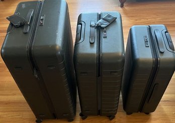 Three Dark Green Away Rolling Suitcases, Small,  Medium & Large.