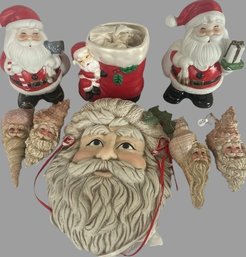Porcelain Santa Clauses. Largest In The Middle Santa Is 9 Long X 7 Wide