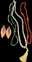 Assorted Beaded Necklaces And Pink Earrings