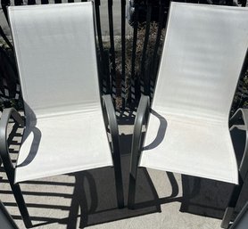 Two Outdoor Mesh & Metal Patio Chairs.