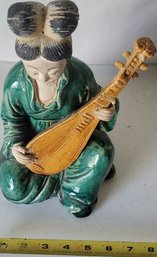 Porcelain Figure , Woman Playing Instrument. Cracked - 6 Length