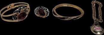 Gold Colored Jewelry With Amber Colored Inlays