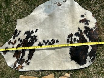 4 Foot Black & White Cowhide Rug & Smaller Hide Pouch With Embellishments
