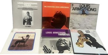 Eight Louis Armstrong Vinyl Records.