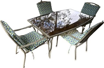 Sepia Tinted Glass Table With Chairs And Gently Used Cushions- (Table 63x39x28) (Chairs 24x28x37)