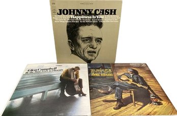 Three Vinyl Records Including Johnny Cash, Glenn Campbell And Jimmie Rodgers