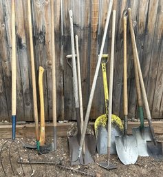 Large Lot Of Outdoor Tools- Pitch Forks, Rakes, Shovels- Longest Tool Is 69in Long