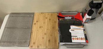 Kitchen Accessorys Including (2) Baking Racks, Wooden Cutting Board, Weber BBQ Tray, Kitchen-Aid Grater