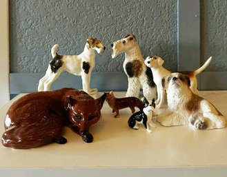 Six Dog Figurines, One Fox