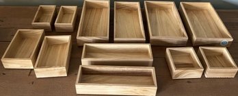 Twelve Wooden Organizer Bins.