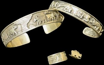 Cuff Bracelets With Safari Scenes. Ring With Man Walking. Rhino Pierced Earrings.