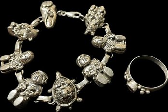 Sterling Bracelet With Happy Asian Figures And Turtle. Sterling Ring With Deep Red Gemstone.