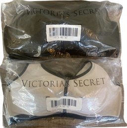 2 New In Packaging Victorias Secret Victoria Sports Bras.  Size 38C. 1 Black And 1 White With Black.