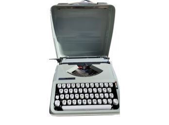 Vintage Portable Hermes Rocket Typewriter In A Mint Green Case.