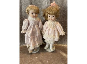 Two Blonde Glass Dolls. One With Collector Doll Tag. Some Stains On Dress. Fair Condition.