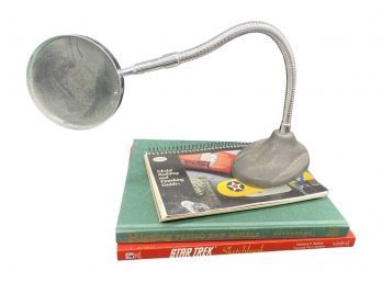 3 Miscellaneous Books And Magnifying Glass On Stand. Books Include Star Trek Sketchbook