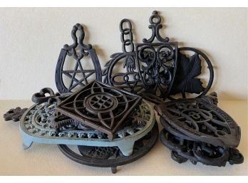 (13) Various Cast Iron Pot Holders, Different Designs And Sizes