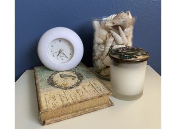 Cute Side Table Elements: Clock, Candle, Shells, And Box Disguised As Book