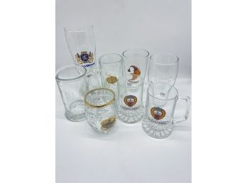 Assortment Of Beer Mugs And Glasses. LowenWeisse, Weltenburger Kloster, Carta Blanca, And Others