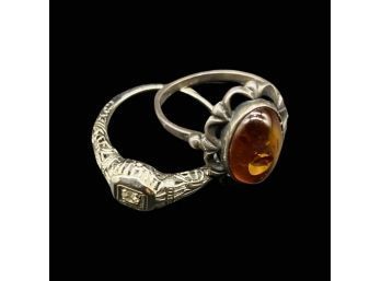 (2) Beautiful Rings, One With Amber Color Design. Sizes Unknown