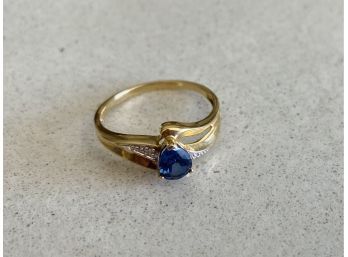 Beautiful Gold Color Ring With Blue Stone And Diamond Accents. No Markings On Ring