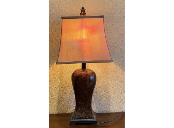 Dark Stained Wood Table Lamp With Intricate Carvings And Multicolored Light Bulb In Working Condition