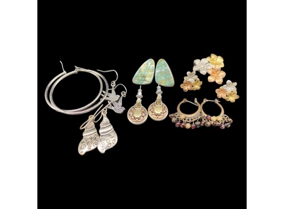 (7) Pairs Of Unique Earrings. Includes (1) Matching Charm