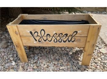 Adorable Wooden Flower Bed With Blessed Painted On The Front